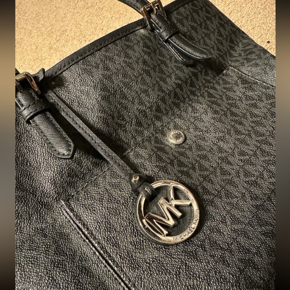 Michael Kors Signature logo pattern and logo charm purse